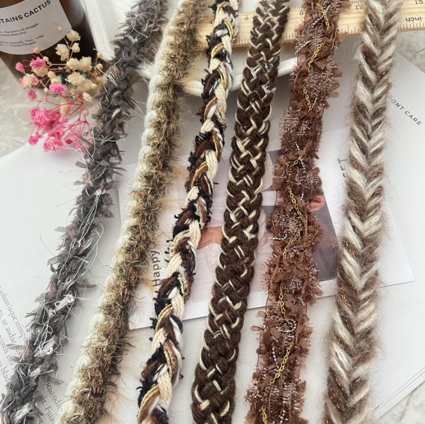 Chanel styles lace briaded trimmings used as decorative accessories for clothing Chanel styles lace briaded trimmings used as decorative accessories for clothing